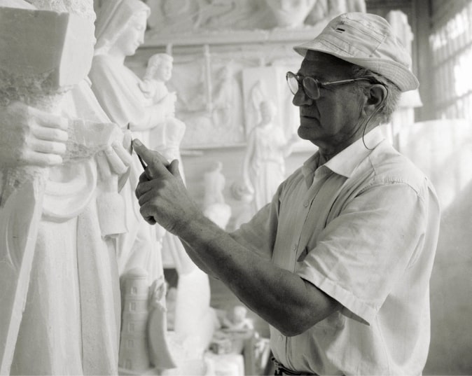 craftsman working marble sculpture